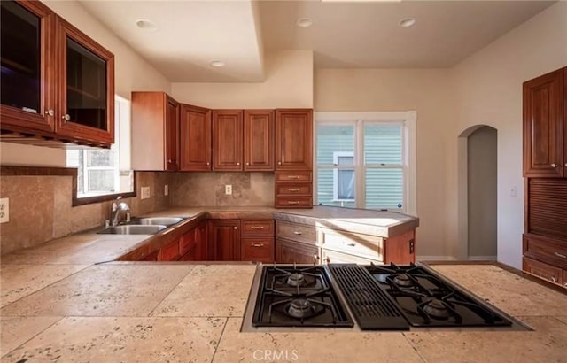 1263 Pismo St, San Luis Obispo, CA 93401 - kitchen featuring cooktop, light countertops, arched walkways, backsplash, and recessed lighting
