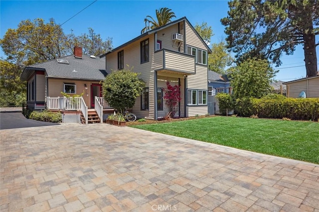1263 Pismo St, San Luis Obispo, CA 93401 - view of front of house with a front lawn, a chimney, a deck, and cooling unit