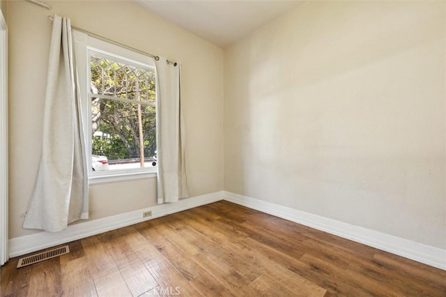 1263 Pismo St, San Luis Obispo, CA 93401 - spare room featuring wood finished floors and baseboards