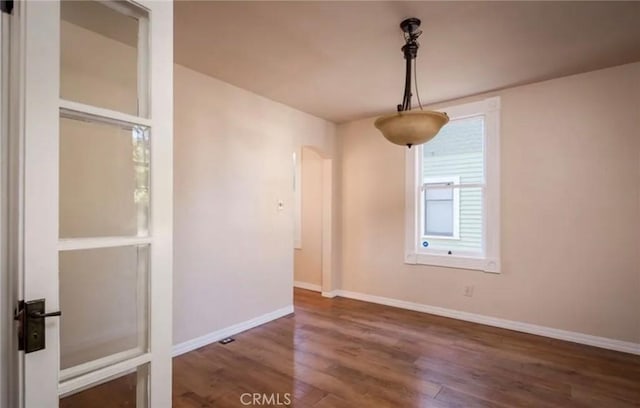 1263 Pismo St, San Luis Obispo, CA 93401 - unfurnished dining area featuring wood finished floors and baseboards