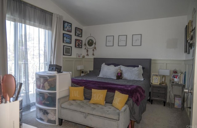 29517 Cara Way, Temecula, CA 92591 - carpeted bedroom featuring multiple windows, a decorative wall, vaulted ceiling, and a wainscoted wall