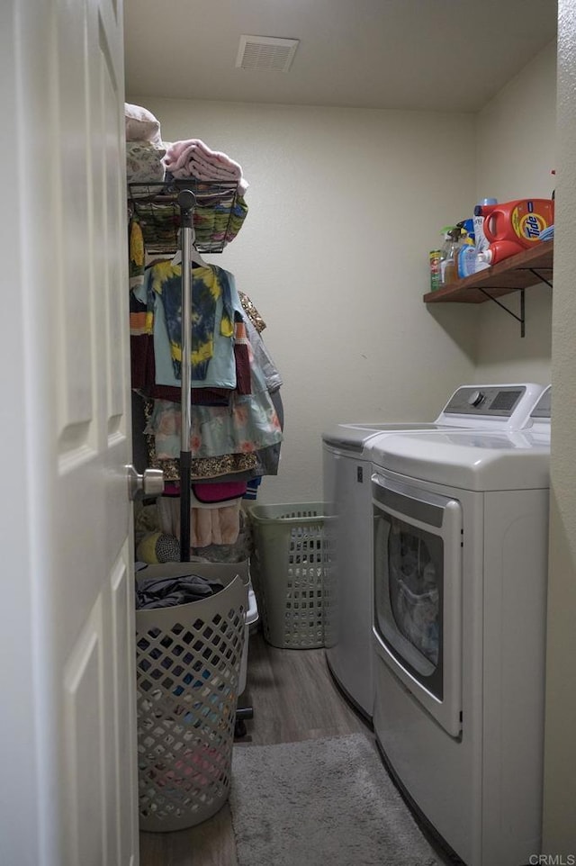 29517 Cara Way, Temecula, CA 92591 - washroom with separate washer and dryer and wood finished floors