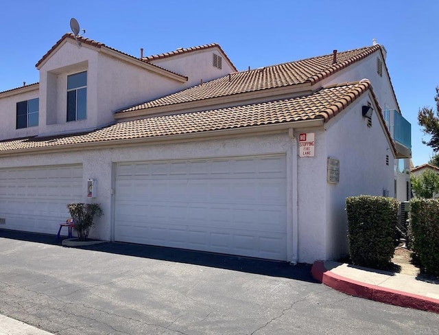 29517 Cara Way, Temecula, CA 92591 - view of property exterior with stucco siding, a garage, and a tile roof