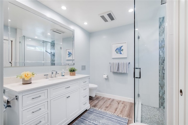 5490 Paseo Del Lago W Unit P, Laguna Woods, CA 92637 - full bathroom featuring vanity, a shower stall, wood finished floors, and recessed lighting