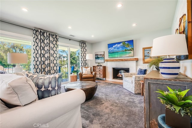 5490 Paseo Del Lago W Unit P, Laguna Woods, CA 92637 - living area featuring a fireplace with flush hearth, recessed lighting, and carpet