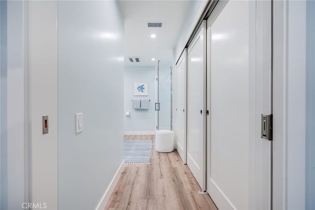5490 Paseo Del Lago W Unit P, Laguna Woods, CA 92637 - hallway with light wood-style floors and recessed lighting