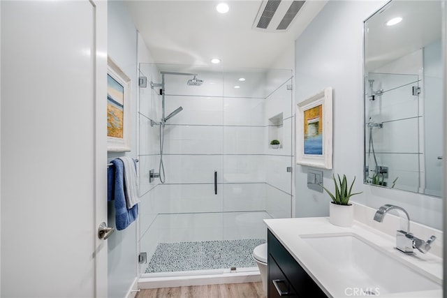 5490 Paseo Del Lago W Unit P, Laguna Woods, CA 92637 - bathroom with vanity, a stall shower, recessed lighting, and wood finished floors
