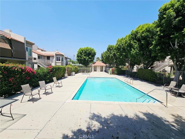 874 Cinnamon Ln Unit 62, Duarte, CA 91010 - community pool featuring a patio and a residential view