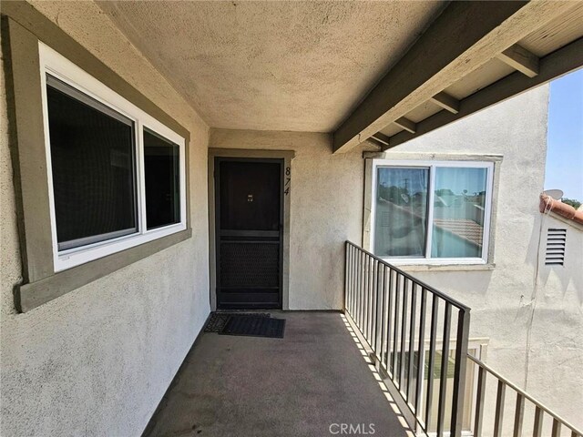 874 Cinnamon Ln Unit 62, Duarte, CA 91010 - doorway to property featuring stucco siding and a balcony