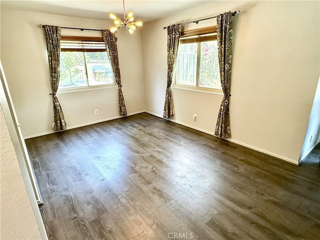 1171 Silverfern Ln, Corona, CA 92878 - spare room featuring a chandelier and dark wood finished floors