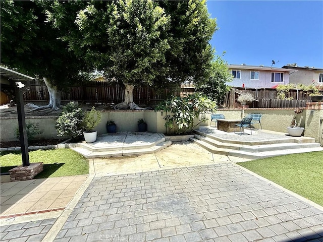 1171 Silverfern Ln, Corona, CA 92878 - fenced backyard with a patio area