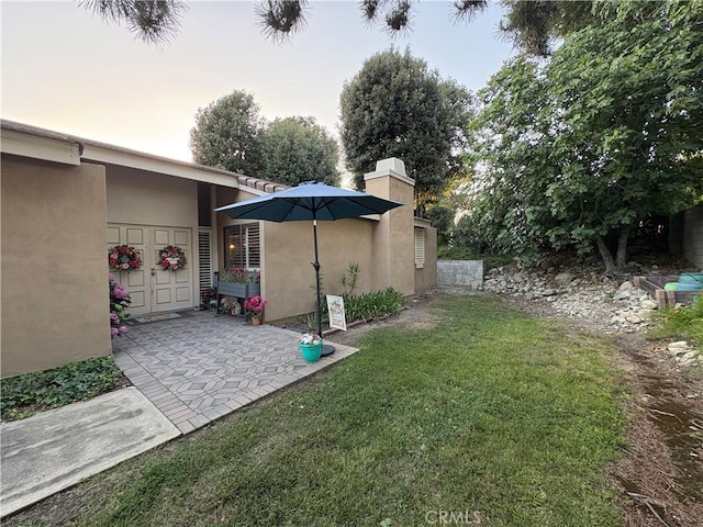 1137 Mountain Gate Rd, Upland, CA 91786 - view of green lawn with a patio area