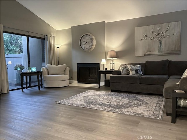 1137 Mountain Gate Rd, Upland, CA 91786 - living room with wood finished floors, lofted ceiling, and a fireplace