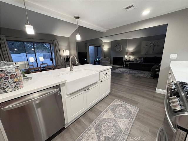 1137 Mountain Gate Rd, Upland, CA 91786 - kitchen featuring stainless steel dishwasher, range, white cabinets, open floor plan, and decorative light fixtures