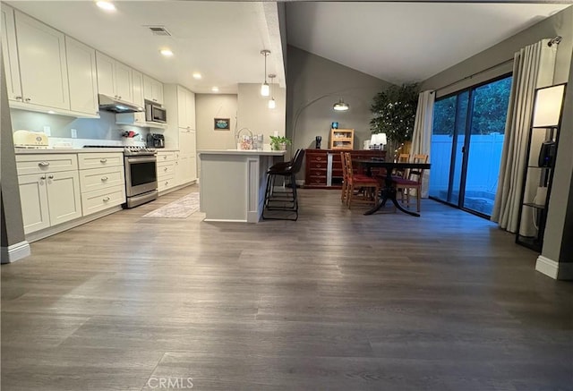 1137 Mountain Gate Rd, Upland, CA 91786 - kitchen with stainless steel appliances, dark wood-style floors, white cabinets, vaulted ceiling, and recessed lighting