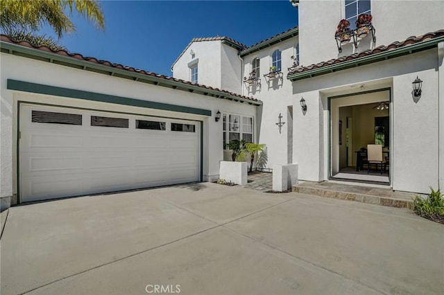 53 Via Palacio, San Clemente, CA 92673 - view of front facade with driveway, a garage, a tiled roof, and stucco siding