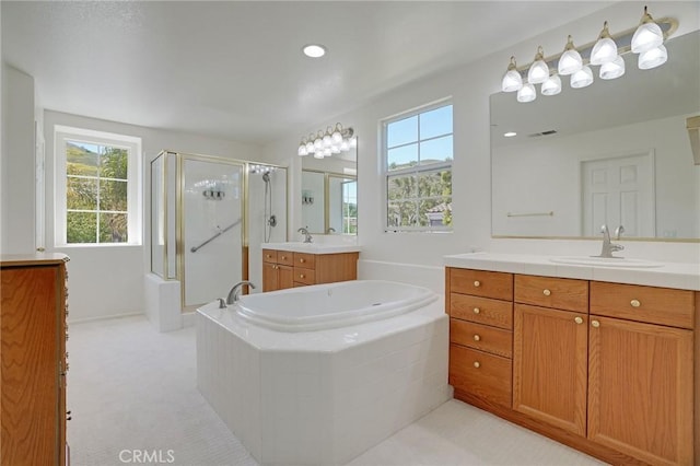 53 Via Palacio, San Clemente, CA 92673 - full bathroom featuring a shower stall, two vanities, plenty of natural light, and a bath