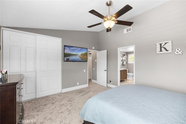 6095 Windemere Way, Riverside, CA 92506 - bedroom featuring vaulted ceiling, light colored carpet, a ceiling fan, ensuite bathroom, and a closet
