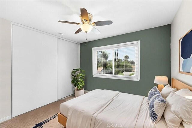 6095 Windemere Way, Riverside, CA 92506 - bedroom featuring carpet, a ceiling fan, and a closet
