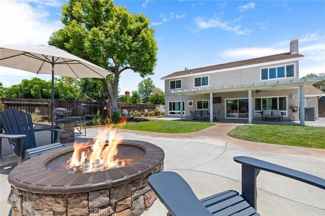 6095 Windemere Way, Riverside, CA 92506 - fenced backyard featuring a fire pit, a patio area, and ceiling fan