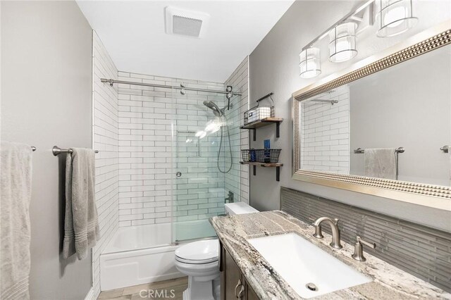 6095 Windemere Way, Riverside, CA 92506 - bathroom featuring vanity and shower / bath combination with glass door