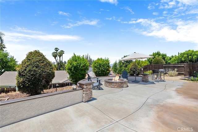 6095 Windemere Way, Riverside, CA 92506 - view of patio / terrace with an outdoor fire pit