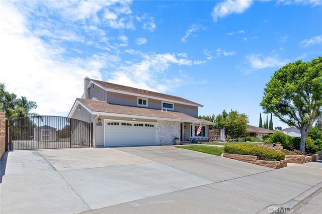 6095 Windemere Way, Riverside, CA 92506 - traditional-style house featuring concrete driveway, a gate, stone siding, and an attached garage