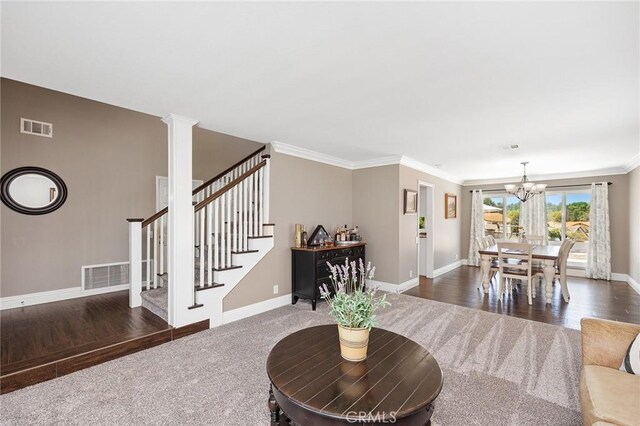 6095 Windemere Way, Riverside, CA 92506 - living room featuring a chandelier, dark carpet, stairway, ornamental molding, and dark wood-style floors