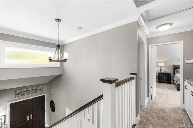 6095 Windemere Way, Riverside, CA 92506 - hall featuring an upstairs landing, light colored carpet, and crown molding