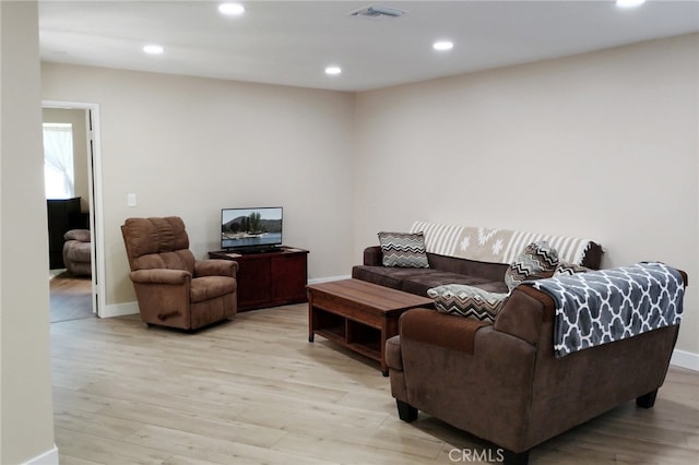 1034 Occidental Cir, Redlands, CA 92374 - living area with light wood-style flooring and recessed lighting