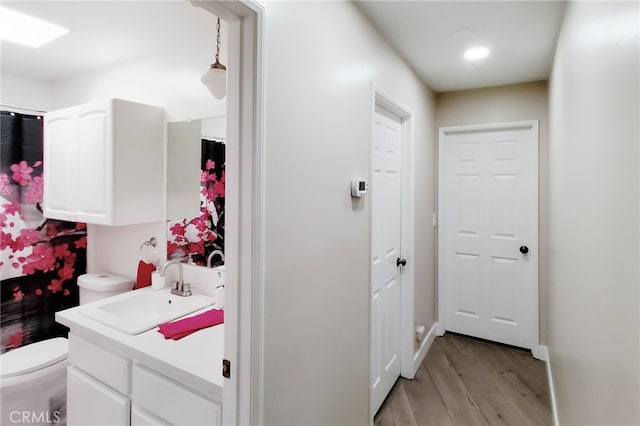 1034 Occidental Cir, Redlands, CA 92374 - bathroom featuring wood finished floors and vanity