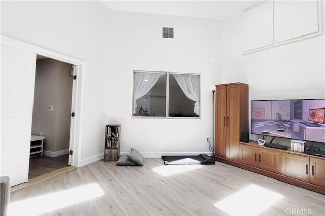 1034 Occidental Cir, Redlands, CA 92374 - unfurnished living room with wood finished floors and a high ceiling