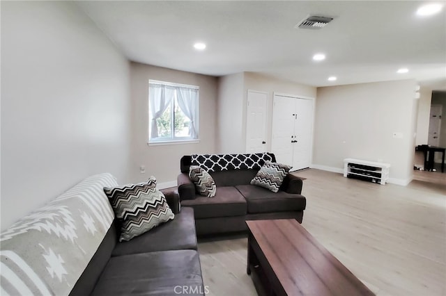 1034 Occidental Cir, Redlands, CA 92374 - living room featuring light wood-style floors and recessed lighting