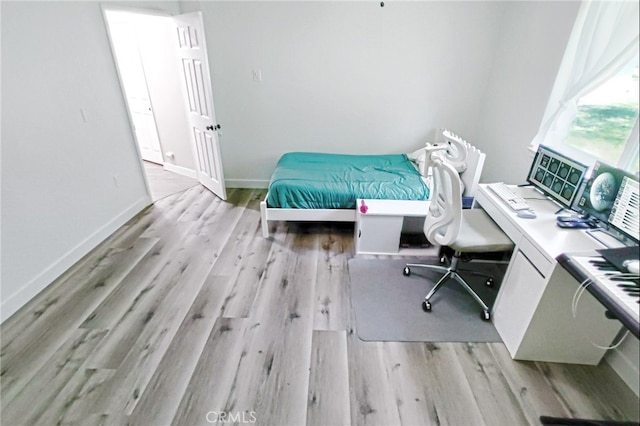 1034 Occidental Cir, Redlands, CA 92374 - bedroom with light wood finished floors and a desk