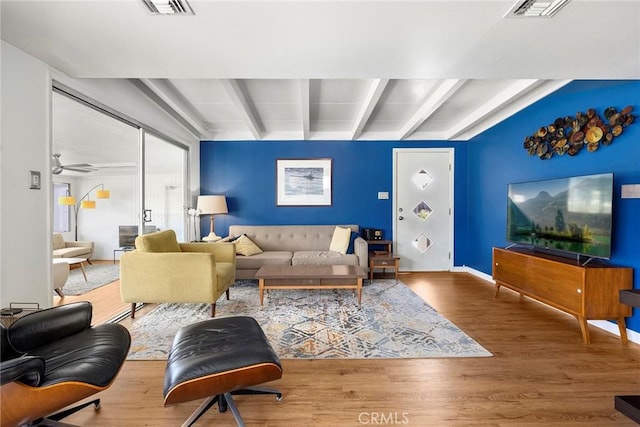 18101 Kirk Ave, Tustin, CA 92780 - living area with beam ceiling, wood finished floors, and ceiling fan