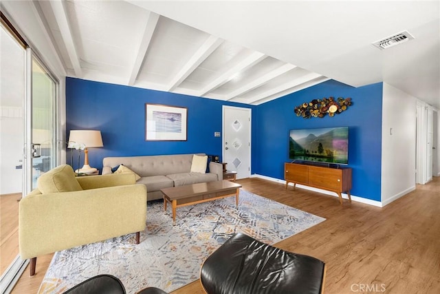 18101 Kirk Ave, Tustin, CA 92780 - living area featuring wood finished floors and beamed ceiling