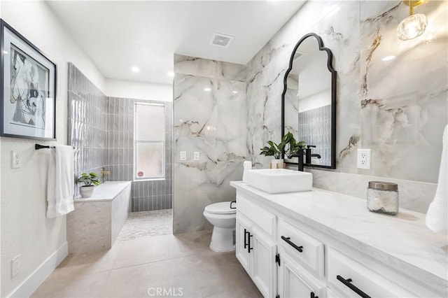 41901 Calle Clarita, Lancaster, CA 93536 - bathroom with tile walls, vanity, a marble finish shower, and tile patterned floors