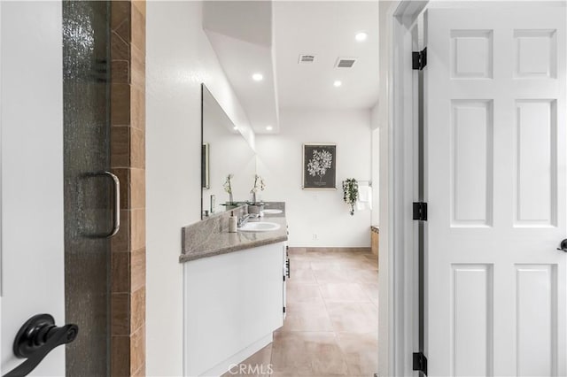 41901 Calle Clarita, Lancaster, CA 93536 - bathroom with double vanity, a stall shower, tile patterned flooring, and recessed lighting