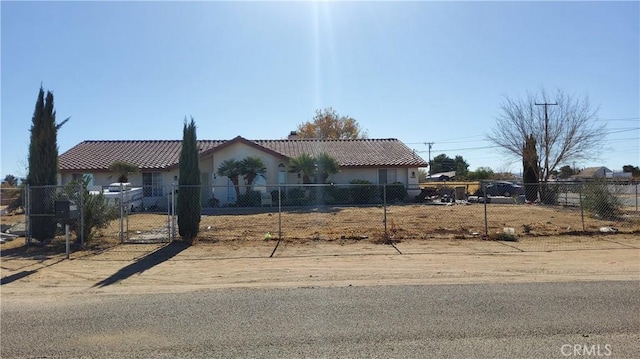 16709 Deodar St, Hesperia, CA 92345 - view of front of home featuring a fenced front yard, a tiled roof, stucco siding, and a gate