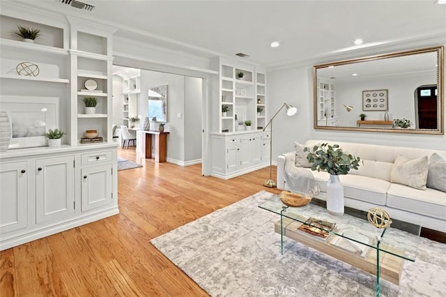 3326 Los Olivos Ln, Glendale, CA 91214 - living room featuring light wood finished floors, crown molding, built in features, and recessed lighting