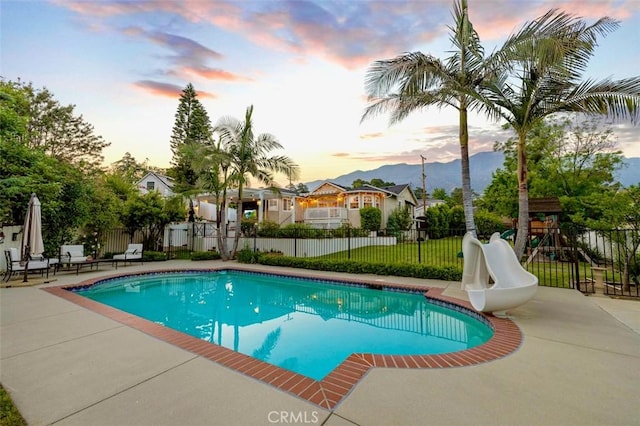 3326 Los Olivos Ln, Glendale, CA 91214 - view of pool with a water slide, a patio area, a playground, and a mountain view