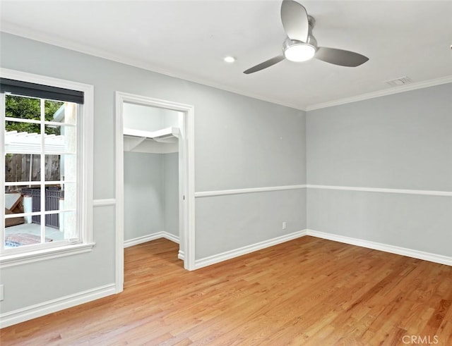 3326 Los Olivos Ln, Glendale, CA 91214 - unfurnished bedroom featuring ornamental molding, light wood-type flooring, a walk in closet, a closet, and ceiling fan