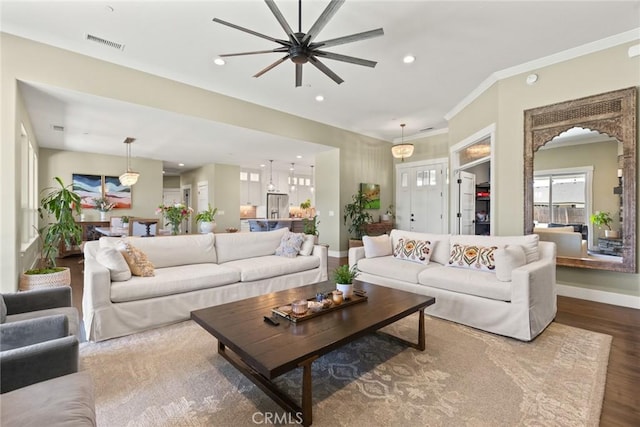 5031 San Juanico Dr, Chico, CA 95973 - living room with wood finished floors, ceiling fan, recessed lighting, arched walkways, and ornamental molding