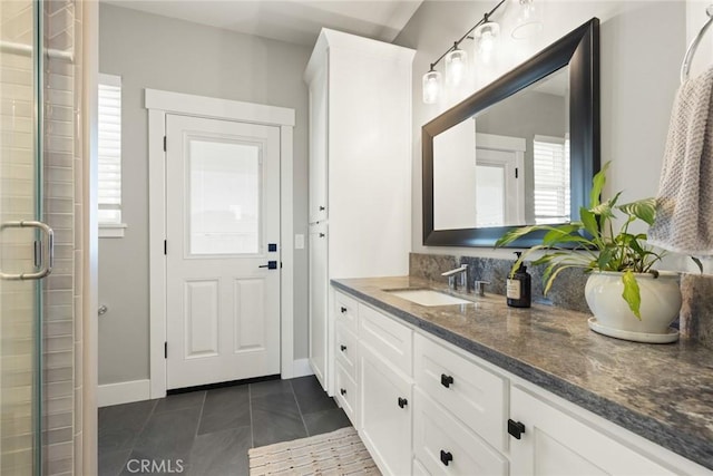 5031 San Juanico Dr, Chico, CA 95973 - full bath with vanity, a stall shower, healthy amount of natural light, and tile patterned floors