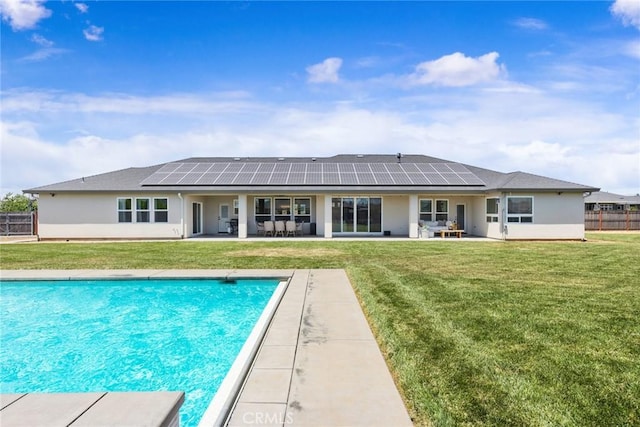 5031 San Juanico Dr, Chico, CA 95973 - back of house featuring roof mounted solar panels, a patio, and stucco siding