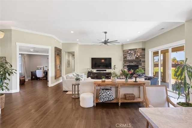 5031 San Juanico Dr, Chico, CA 95973 - living area featuring ceiling fan, dark wood finished floors, crown molding, a stone fireplace, and recessed lighting