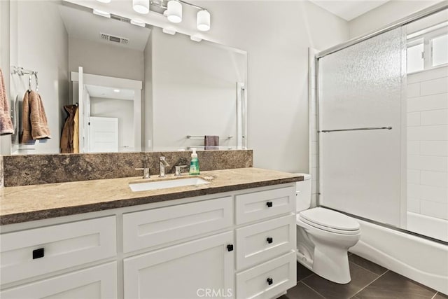 5031 San Juanico Dr, Chico, CA 95973 - full bath featuring vanity, enclosed tub / shower combo, and tile patterned flooring