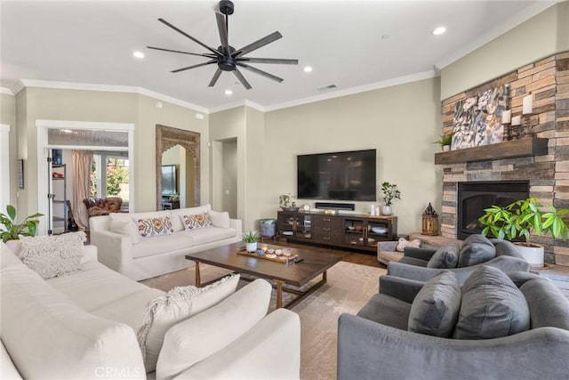 5031 San Juanico Dr, Chico, CA 95973 - living area with ceiling fan, recessed lighting, ornamental molding, wood finished floors, and a stone fireplace