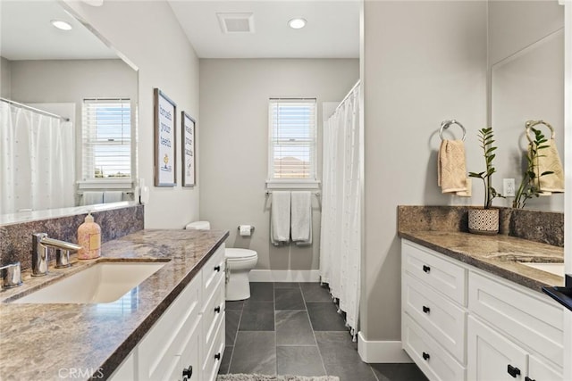 5031 San Juanico Dr, Chico, CA 95973 - bathroom with two vanities, tile patterned floors, recessed lighting, and curtained shower