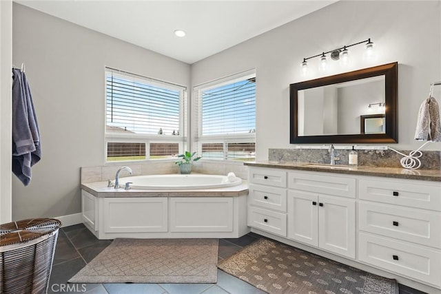 5031 San Juanico Dr, Chico, CA 95973 - bathroom with vanity, a garden tub, and tile patterned flooring